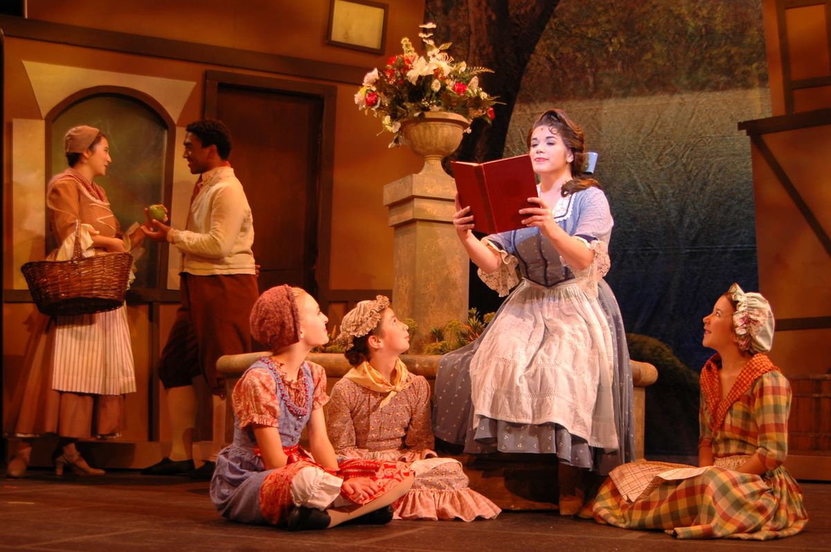 Belle reading a book in Act 1 performing "Belle" Belle reading a book in Act 1 performing "Belle"
