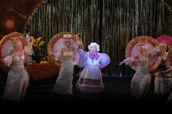 Belle reading a book in Act 1 performing 