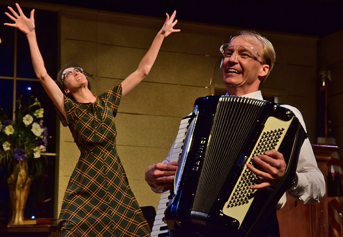 une Sanders (Morgan Jackson-Tucker), left, "signs" as the Rev. Mervin Oglethorpe (A.J. Morrison) plays accordion to "Bringing in the Sheaves" in Smoke on the Mountain. One of the most popular productions at Beef & Boards, Smoke on the Mountain is on stage through June 20. In accordance with safety protocols, audiences are distanced, and masks are required. For more information, visit beefandboards.com. une Sanders (Morgan Jackson-Tucker), left, "signs" as the Rev. Mervin Oglethorpe (A.J. Morrison) plays accordion to "Bringing in the Sheaves" in Smoke on the Mountain. One of the most popular productions at Beef & Boards, Smoke on the Mountain is on stage through June 20. In accordance with safety protocols, audiences are distanced, and masks are required. For more information, visit beefandboards.com.
