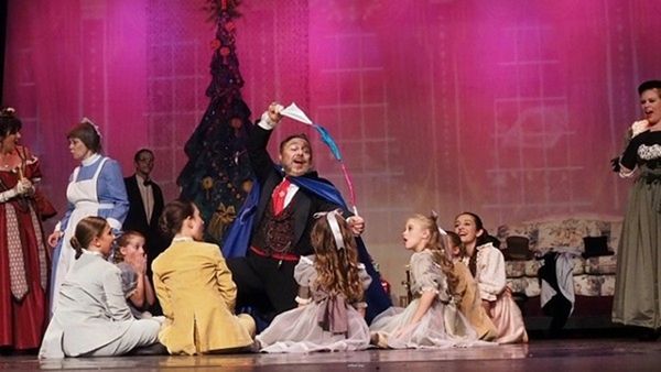 Edward R. Cox as Uncle Drosselmayer performs magic to entertain the Party Children. 1