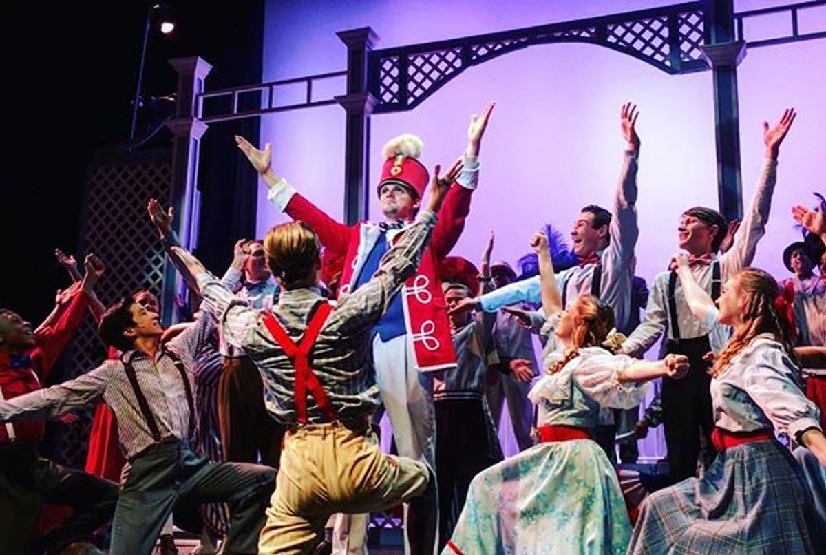 The Music Man follows fast-talking traveling salesman Harold Hill as he cons the people of River City, Iowa into buying instruments and uniforms for a boys' band he vows to organize - this despite the fact he doesn't know a trombone from a treble clef. His plans to skip town with the cash are foiled when he falls for Marian the librarian, who transforms him into a respectable citizen by curtain's fall.
Photo Credit: Michelle Jerome The Music Man follows fast-talking traveling salesman Harold Hill as he cons the people of River City, Iowa into buying instruments and uniforms for a boys' band he vows to organize - this despite the fact he doesn't know a trombone from a treble clef. His plans to skip town with the cash are foiled when he falls for Marian the librarian, who transforms him into a respectable citizen by curtain's fall.
Photo Credit: Michelle Jerome