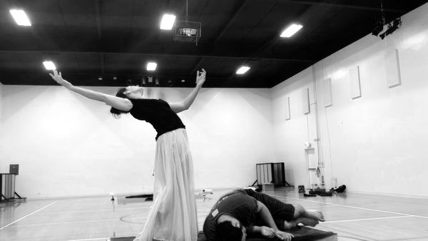 Rehearsal still: performers Julie A. Lockhart and Jonathan C.K. Williams expand and contract in the pits of Gehenna. 1