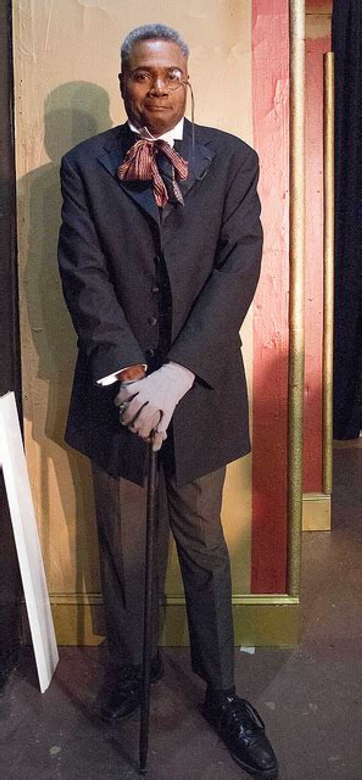 Backstage At The Music Hall Royale The Chairman Prepares!: Veteran stage actor and play director Darryl Maximilian Robinson prepares to make his entrance into his dual roles of The Chairman Mr. William Cartwright and Mayor Thomas Sapsea in the 2018 Saint Sebastian Players of Chicago Revival of Rupert Holmes' Tony Award-winning Best Musical Whodunit 'The Mystery of Edwin Drood'. Photo by Eryn Walanka.
Backstage At The Music Hall Royale The Chairman Prepares!: Veteran stage actor and play director Darryl Maximilian Robinson prepares to make his entrance into his dual roles of The Chairman Mr. William Cartwright and Mayor Thomas Sapsea in the 2018 Saint Sebastian Players of Chicago Revival of Rupert Holmes' Tony Award-winning Best Musical Whodunit 'The Mystery of Edwin Drood'. Photo by Eryn Walanka.