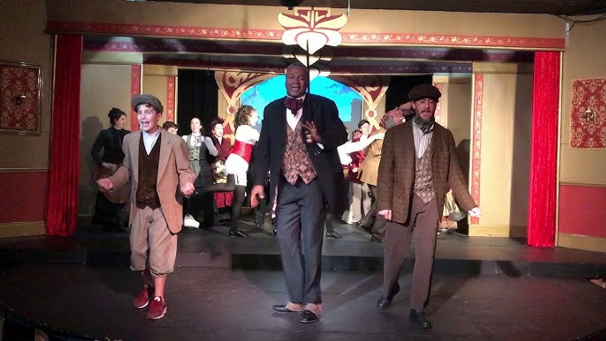 Going 'Off To The Races'!: Joined on his left by Nate Becker as The Deputy and Master Nick Cricker II, and on his right by Eric S. Prahl as Durdles and Mr. Nick Cricker, Sr., Darryl Maximilian Robinson ( center ) in his dual roles of The Chairman Mr. William Cartwright and Mayor Thomas Sapsea leads the cast in the first act finale of the 2018 Saint Sebastian Players of Chicago revival of Rupert Holmes' Tony Award-winning Best Musical Whodunit 'The Mystery of Edwin Drood'. Photo courtesy of Afanofthemysteree. Going 'Off To The Races'!: Joined on his left by Nate Becker as The Deputy and Master Nick Cricker II, and on his right by Eric S. Prahl as Durdles and Mr. Nick Cricker, Sr., Darryl Maximilian Robinson ( center ) in his dual roles of The Chairman Mr. William Cartwright and Mayor Thomas Sapsea leads the cast in the first act finale of the 2018 Saint Sebastian Players of Chicago revival of Rupert Holmes' Tony Award-winning Best Musical Whodunit 'The Mystery of Edwin Drood'. Photo courtesy of Afanofthemysteree.