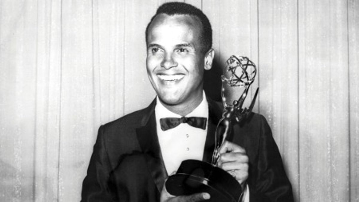 AMERICA'S FIRST AFRICAN-AMERICAN MALE PERFORMER TO WIN THE EMMY!: Here is the legendary star Harry Belafonte with his 1960 Emmy Award as Outstanding Performer for his 1959 television music special "Tonight With Harry Belafonte".