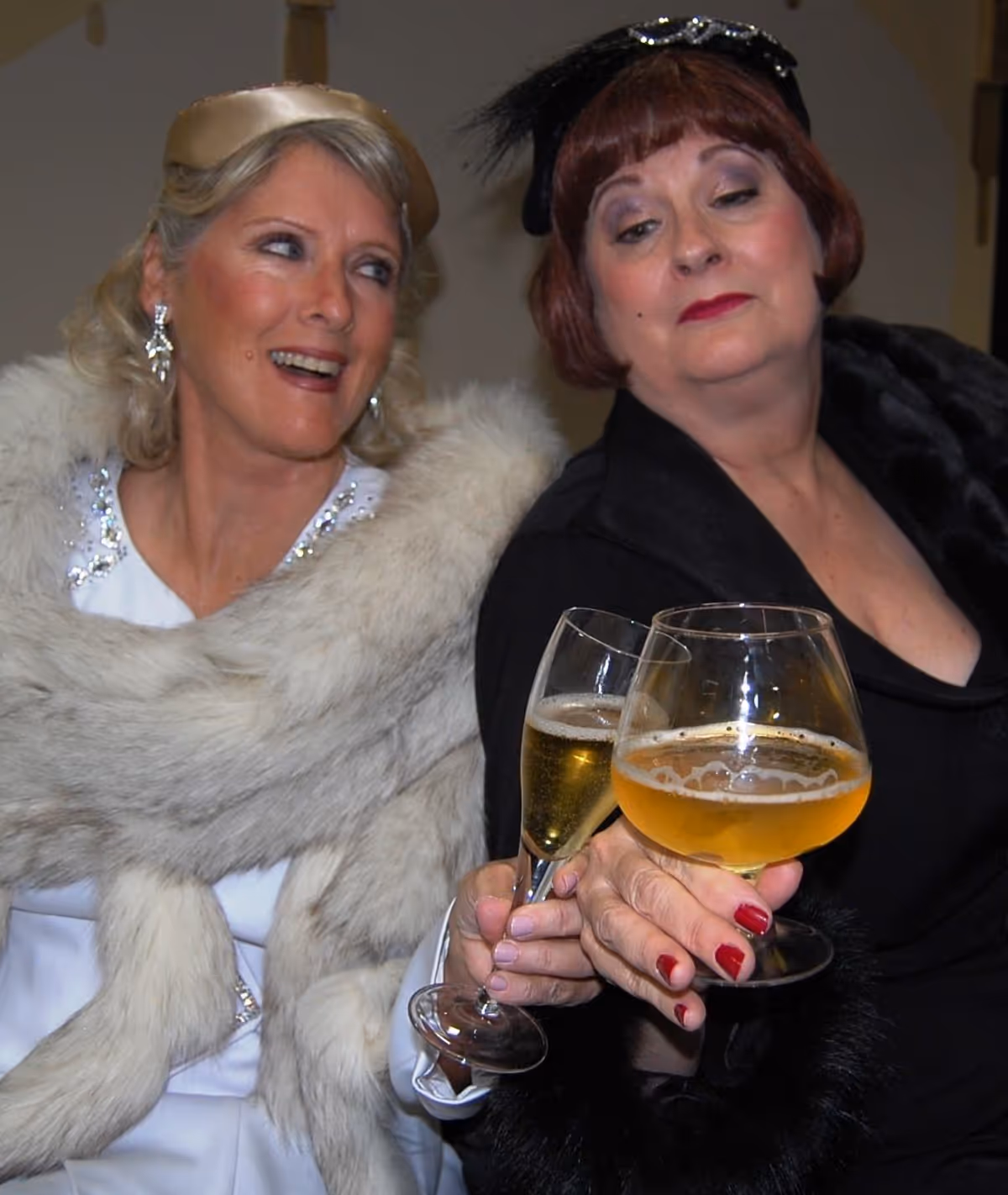 Left to Right: Mame Dennis (Patty Ward) and her Bosom Buddy Vera Charles (Sue Chekaway) toast to their old, old, old friendship. Left to Right: Mame Dennis (Patty Ward) and her Bosom Buddy Vera Charles (Sue Chekaway) toast to their old, old, old friendship.