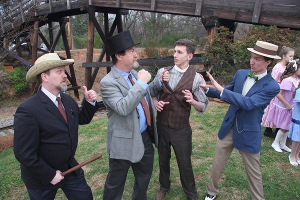 Con salesman Harold Hill confronts Law and Order in River City. 3