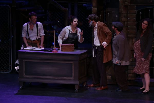 David Geinosky as Bobby Strong with the cast of Theatre Nebula's Urinetown, The Musical! 2