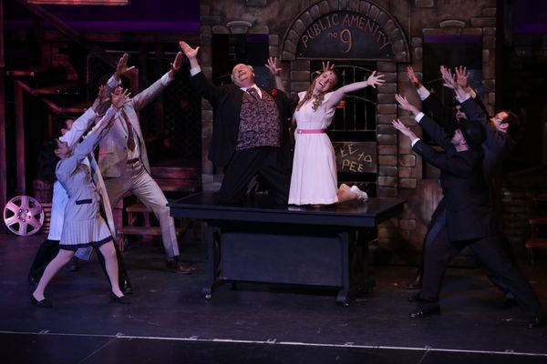 David Geinosky as Bobby Strong with the cast of Theatre Nebula's Urinetown, The Musical! 3