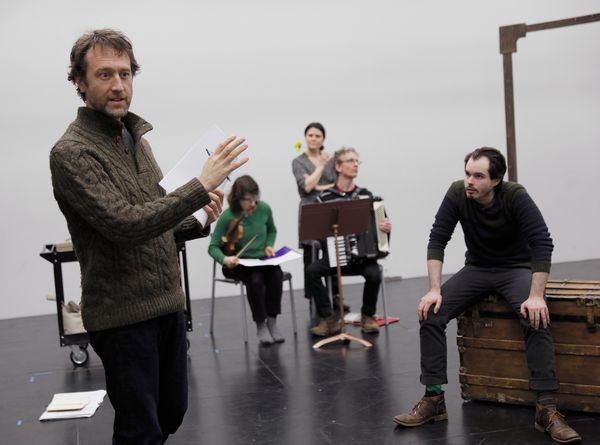 Composer BRENT ARNOLD discusses stagins with the musicians and ensemble of THE MASTER & MARGARITA. 1