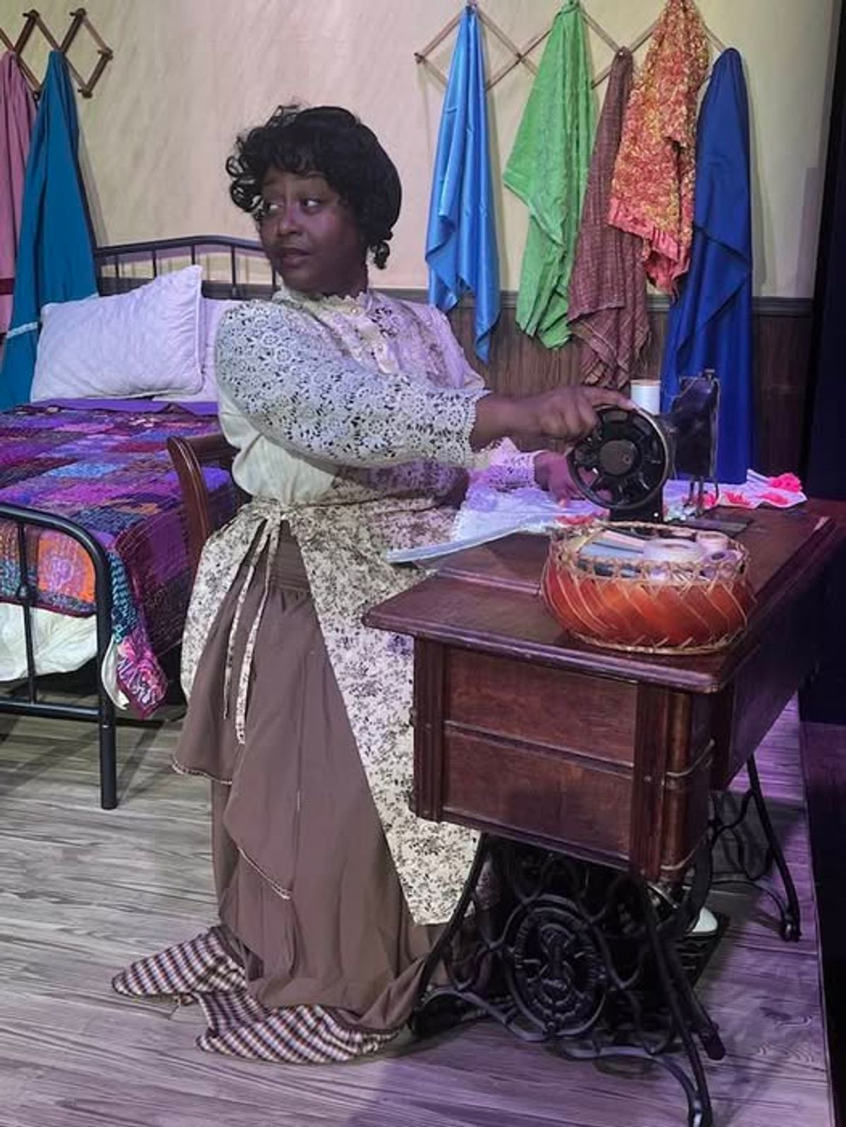Esther (Nakeisha McGee) is stitching away on INTIMATE APPAREL for a client in the opener for Season 42 at Carpenter Square. 