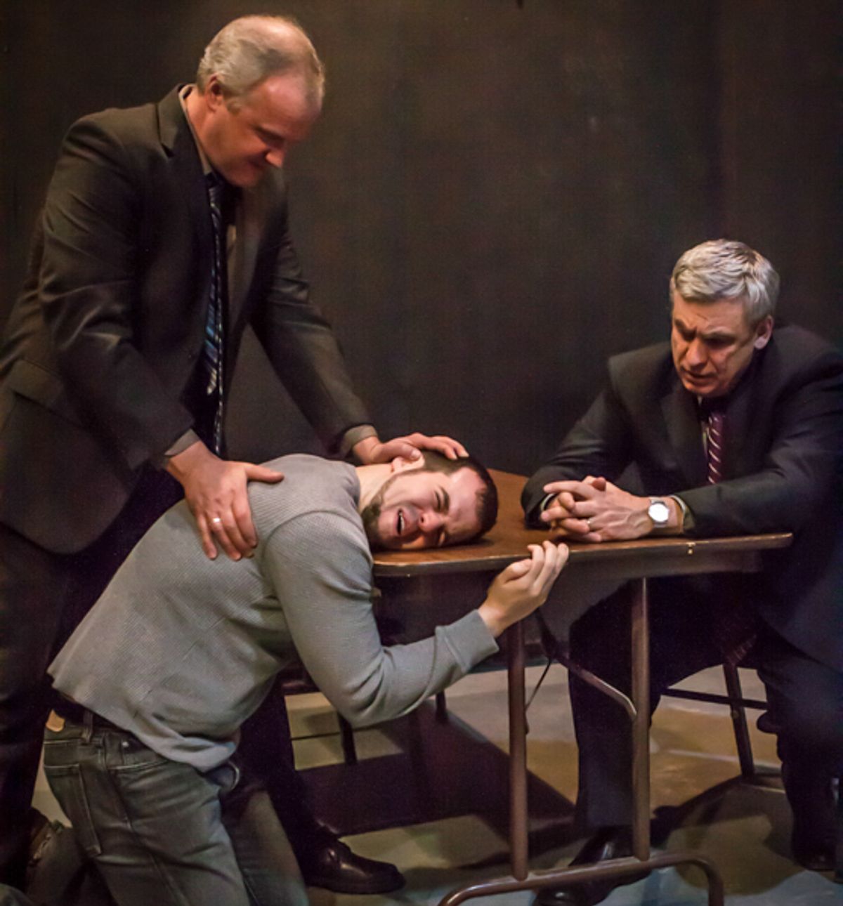 Ariel (John Ade) l and Tupolski (Scott Nangle) interrogate the writer, Katurian (Tom Mazzarella) in a scene from The Pillowman. Ariel (John Ade) l and Tupolski (Scott Nangle) interrogate the writer, Katurian (Tom Mazzarella) in a scene from The Pillowman.