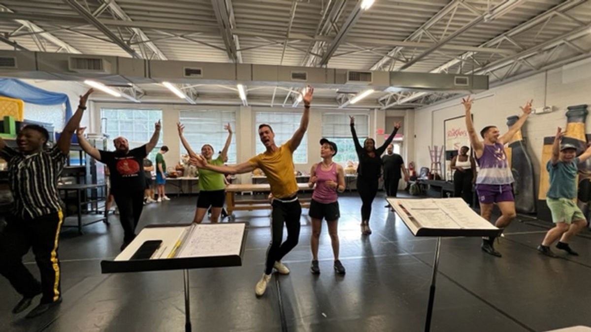 Stephen Petrovich (Lumiere) and Ella Raymont (Belle) leading the cast through rehearsal for "Be Our Guest" Stephen Petrovich (Lumiere) and Ella Raymont (Belle) leading the cast through rehearsal for "Be Our Guest"