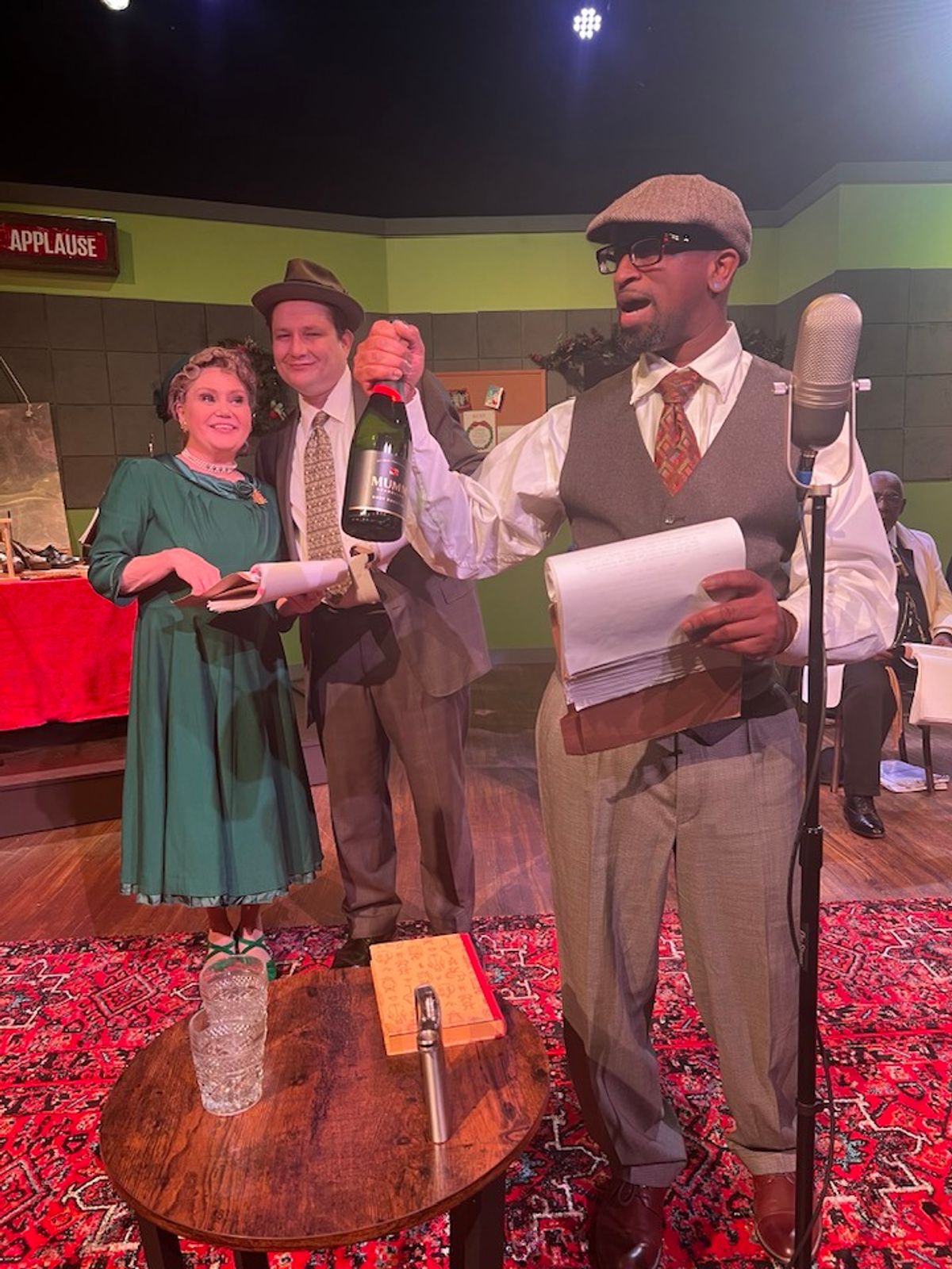Here, the newlyweds are ready to celebrate, but will Ernie get the Baileys to the train? Pictured L-R: Shelly Harmon, C.W. Bardsher, K. DerRon Vinson Here, the newlyweds are ready to celebrate, but will Ernie get the Baileys to the train? Pictured L-R: Shelly Harmon, C.W. Bardsher, K. DerRon Vinson