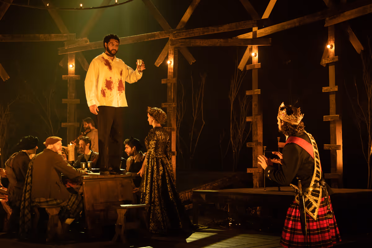 Macbeth (Benjamin Bonenfant) sees the ghost of Banquo (Cordell Cole) after Macbeth gives the order for him to be murdered. Members of the banquet (including Meghan Andrews as Lady Macbeth) do not see the apparition and look on in confusion. Photo by Hillary Taylor for Alabama Shakespeare Festival. Macbeth (Benjamin Bonenfant) sees the ghost of Banquo (Cordell Cole) after Macbeth gives the order for him to be murdered. Members of the banquet (including Meghan Andrews as Lady Macbeth) do not see the apparition and look on in confusion. Photo by Hillary Taylor for Alabama Shakespeare Festival.
