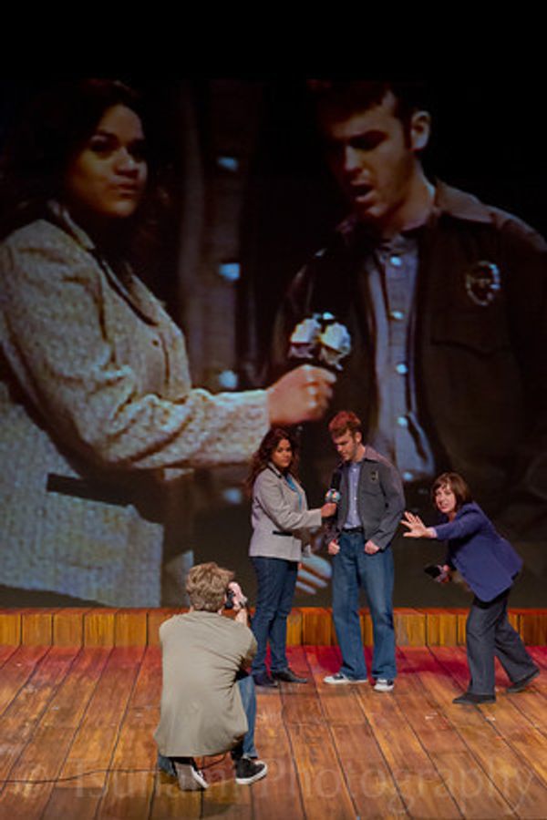 Live feed- a reporter interviews Sergeant Hing.

© 2012 by Louis E. Keiner and Lesley M. Etherson 9