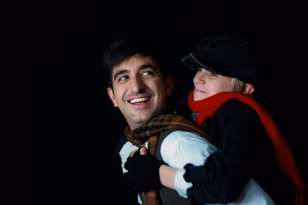Andrew Berardi as Bob Cratchit and Lucas Mather as Tiny Tim. Photo courtesy of Lauren Cibene 8