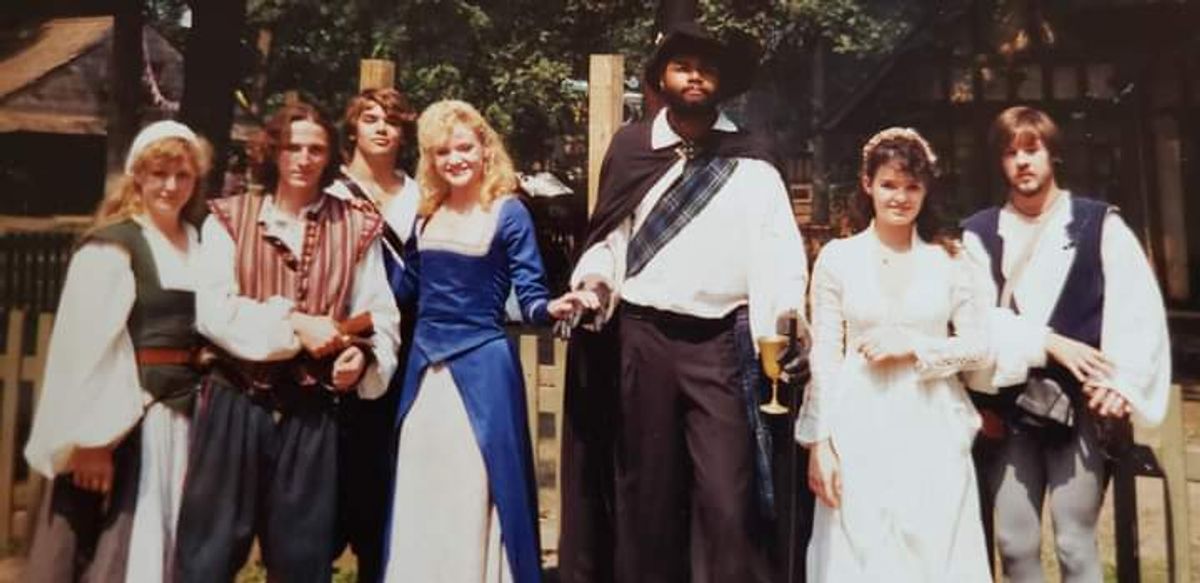 Seen here with lovely and talented young actress Amy Ladley as Lady Lillith ( being escorted at center-left, who did fine Improv scene work and gave a strong dramatic reading of The Bard's Sonnets towards the end of each and every faire day ) and the invaluable comedic faire actor Tony Hrubes ( at far right ) along with other loyal, committed and capable performers who poured their hearts into performing and serving as The Shakespearean Players of Bristol, Your Humble Servant In The Theatre, Darryl Maximilian Robinson ( at center ), playing His Most Revered Lordship, Sir Richard Drury Kemp-Kean ( Shakespearean actor and time-traveler ) had one of the highlights of his career working with these talented folks who brought The Immortal Bard's scenes and words to life at the 1989 Bristol Renaissance Faire, where as Director and Instructor of Shakespearean Theatre for The Bristol Theatre Academy he had the privilege and pleasure of supervising their often wonderful work.
Darryl Maximilian Robinson is grateful and blessed to have worked with these fine artists and human beings during his summers at The Bristol Renaissance Faire and remembers them all with affection.
Seen here with lovely and talented young actress Amy Ladley as Lady Lillith ( being escorted at center-left, who did fine Improv scene work and gave a strong dramatic reading of The Bard's Sonnets towards the end of each and every faire day ) and the invaluable comedic faire actor Tony Hrubes ( at far right ) along with other loyal, committed and capable performers who poured their hearts into performing and serving as The Shakespearean Players of Bristol, Your Humble Servant In The Theatre, Darryl Maximilian Robinson ( at center ), playing His Most Revered Lordship, Sir Richard Drury Kemp-Kean ( Shakespearean actor and time-traveler ) had one of the highlights of his career working with these talented folks who brought The Immortal Bard's scenes and words to life at the 1989 Bristol Renaissance Faire, where as Director and Instructor of Shakespearean Theatre for The Bristol Theatre Academy he had the privilege and pleasure of supervising their often wonderful work.
Darryl Maximilian Robinson is grateful and blessed to have worked with these fine artists and human beings during his summers at The Bristol Renaissance Faire and remembers them all with affection.