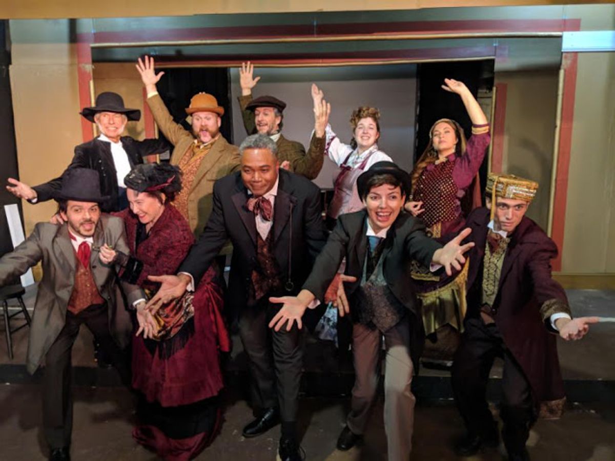 Damned, But There You Are!: Darryl Maximilian Robinson as The Chairman Mr. William Cartwright and Mayor Thomas Sapsea and Sarah Myers as Edwin Drood and Miss Alice Nutting ( at center ) lead the Principal Cast Members in the opening number 'There You Are' in the 2018 Saint Sebastian Players of Chicago Revival of Rupert Holmes' 'The Mystery of Edwin Drood.' Photo by Eryn Walanka. Damned, But There You Are!: Darryl Maximilian Robinson as The Chairman Mr. William Cartwright and Mayor Thomas Sapsea and Sarah Myers as Edwin Drood and Miss Alice Nutting ( at center ) lead the Principal Cast Members in the opening number 'There You Are' in the 2018 Saint Sebastian Players of Chicago Revival of Rupert Holmes' 'The Mystery of Edwin Drood.' Photo by Eryn Walanka.