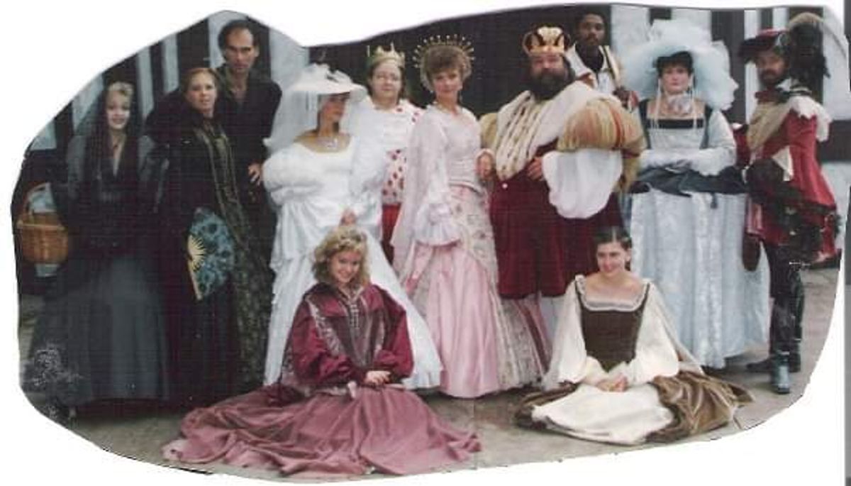 EXCALIBER SHAKESPEARE COMPANY OF CHICAGO FOUNDER DARRYL MAXIMILIAN ROBINSON SHARES A 1980S THEATRICAL MEMORY THAT'S STAINED WITH A LITTLE BLOOD! HOW CLOSE IS A KILLER TO THE CROWN?: Behold the Royal Court of Barbara Burinski as Her Majesty, Queen Katherine and Ray Nelson as His Majesty, King Richard ( poised in their regal robes at center ). A VERY HAPPY COUPLE, NO QUESTION! But who near them is capable of MURDER, AND MURDER MOST FOUL AT A ROYAL WEDDING? Is it one of the Borgias' Royal Party from Italy ( on the far left ), capable of deadly swordplay and / or poisoning in an instant? Is it their extremely loyal Lord Chancellor, Sir Percival Degage', played by Richard D. Weber ( on the far right ) who, with satin or silk, is willing to kill with ease over the slightest fashion violation? Or is it someone even closer to The Crown. Standing beside the Queen is her younger sister, Princess Marigold of Lincolnshire, the scheduled bride, who may or may not be entirely pleased with the man near her, and scheduled groom, the Prince of France. Behind the right of the King is Darryl Maximilian Robinson as His Eminence, Tomas de Torquemada, The Grand Inquisitor of Spain, who has some serious experience conducting an investigation ( but due to his own nefarious and notorious reputation as The Presiding High Official of The Church for The Spanish Inquisition ) finds he too is a Suspect! Everyone here is CAPABLE OF MURDER. And only Visitors and Guests To King Richard's Faire will ( By Their Votes! ) decide at each performance WHODUNIT in "Murder, They Quoth" the musical comedy mystery Grand Scenario of the 1986 King Richard's Faire of Kenosha, Wisconsin. LONG LIVE THE FAIRE!
EXCALIBER SHAKESPEARE COMPANY OF CHICAGO FOUNDER DARRYL MAXIMILIAN ROBINSON SHARES A 1980S THEATRICAL MEMORY THAT'S STAINED WITH A LITTLE BLOOD! HOW CLOSE IS A KILLER TO THE CROWN?: Behold the Royal Court of Barbara Burinski as Her Majesty, Queen Katherine and Ray Nelson as His Majesty, King Richard ( poised in their regal robes at center ). A VERY HAPPY COUPLE, NO QUESTION! But who near them is capable of MURDER, AND MURDER MOST FOUL AT A ROYAL WEDDING? Is it one of the Borgias' Royal Party from Italy ( on the far left ), capable of deadly swordplay and / or poisoning in an instant? Is it their extremely loyal Lord Chancellor, Sir Percival Degage', played by Richard D. Weber ( on the far right ) who, with satin or silk, is willing to kill with ease over the slightest fashion violation? Or is it someone even closer to The Crown. Standing beside the Queen is her younger sister, Princess Marigold of Lincolnshire, the scheduled bride, who may or may not be entirely pleased with the man near her, and scheduled groom, the Prince of France. Behind the right of the King is Darryl Maximilian Robinson as His Eminence, Tomas de Torquemada, The Grand Inquisitor of Spain, who has some serious experience conducting an investigation ( but due to his own nefarious and notorious reputation as The Presiding High Official of The Church for The Spanish Inquisition ) finds he too is a Suspect! Everyone here is CAPABLE OF MURDER. And only Visitors and Guests To King Richard's Faire will ( By Their Votes! ) decide at each performance WHODUNIT in "Murder, They Quoth" the musical comedy mystery Grand Scenario of the 1986 King Richard's Faire of Kenosha, Wisconsin. LONG LIVE THE FAIRE!