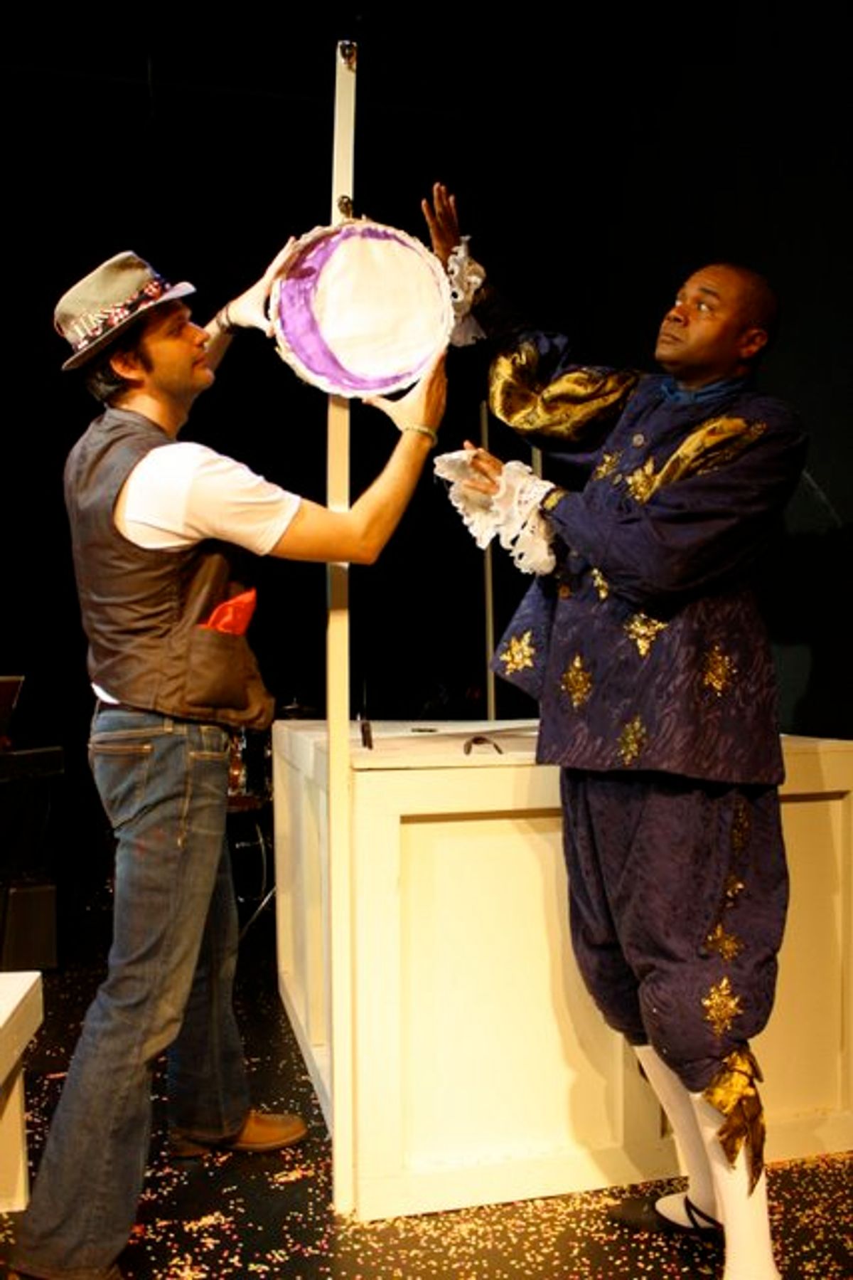 THE RISING OF THE MOON!: Christopher Karbo as El Gallo and Darryl Maximilian Robinson as the old Shakespearean actor Henry Albertson put The Moon in its proper place in a scene from the 2010 Tribe Productions 50th anniversary revival production of Tom Jones' and Harvey Schmidt's classic, romantic musical "The Fantasticks" presented as part of the first-ever Hollywood Fringe Festival at The Complex Theatre of Los Angeles. THE RISING OF THE MOON!: Christopher Karbo as El Gallo and Darryl Maximilian Robinson as the old Shakespearean actor Henry Albertson put The Moon in its proper place in a scene from the 2010 Tribe Productions 50th anniversary revival production of Tom Jones' and Harvey Schmidt's classic, romantic musical "The Fantasticks" presented as part of the first-ever Hollywood Fringe Festival at The Complex Theatre of Los Angeles.