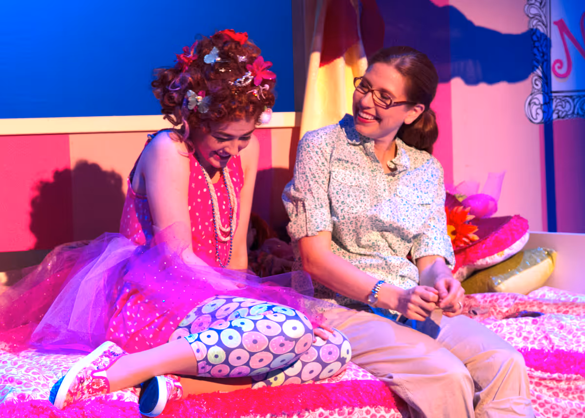 Jillian Batt as Nancy and Erika C. Miller as Mrs. Clancy in Chance Theater's TYA production of "Fancy Nancy, The Musical". Playing through June 19, 2022, this musical adaptation of the popular book series has book and lyrics by Susan DiLallo, music and lyrics by Danny Abosch, and is directed by Laura M. Hathaway and music directed by Robyn Manion. Photo by Doug Catiller.