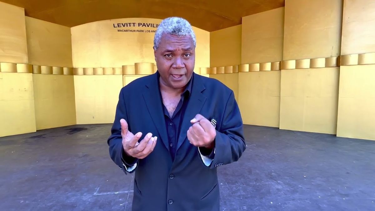Playing Poe At The Pavilion: On July 19, 2022, veteran and award-winning stage actor and play director Darryl Maximilian Robinson recorded his new "street theatre"-style rendition of Edgar Allan Poe's 'The Conqueror Worm' at The Levitt Pavilion of MacArthur Park in Los Angeles. Photo and video by Danny Belrose. Playing Poe At The Pavilion: On July 19, 2022, veteran and award-winning stage actor and play director Darryl Maximilian Robinson recorded his new "street theatre"-style rendition of Edgar Allan Poe's 'The Conqueror Worm' at The Levitt Pavilion of MacArthur Park in Los Angeles. Photo and video by Danny Belrose.
