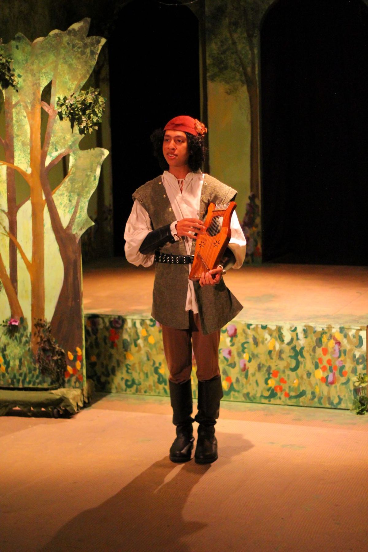 Amiens (Garret Martinez) brings some much needed music to the forest of Arden. Photo by Luis Aranda