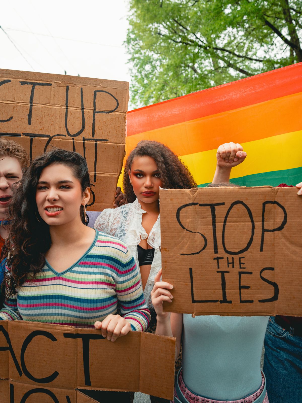 (L to R): Jonah Uffelman (Nikolas/The Guard), Victoria Martinez (Ensemble/Swing), and Emmalynn Bruce (Antigone Tig) in a promotional image for Antigone 1989: A Town Hall Musical, premiering this Augus