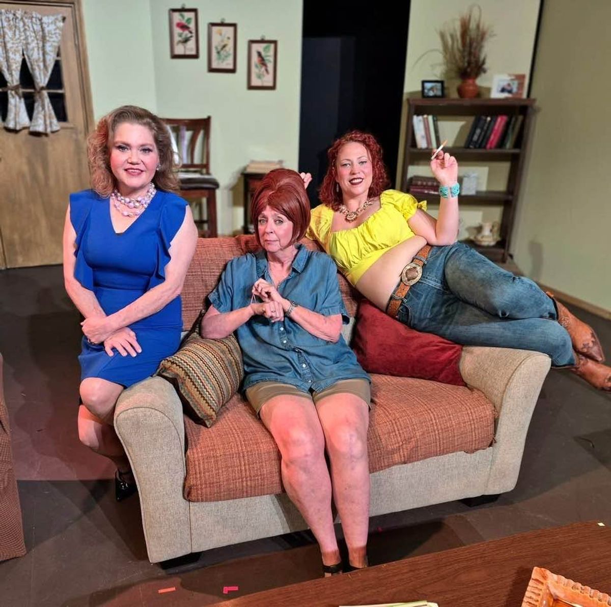 These ladies say,    Come on down y   all and see our sordid show!   