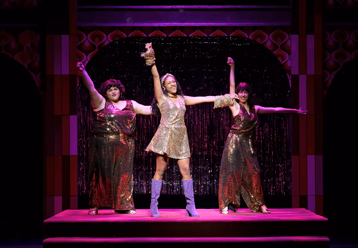 Center: Karriyma Pekary as (Deloris Van Cartier). Left: Melissa Martinez as (Tina). Right: Haley Clarke as (Michelle) Center: Karriyma Pekary as (Deloris Van Cartier). Left: Melissa Martinez as (Tina). Right: Haley Clarke as (Michelle)