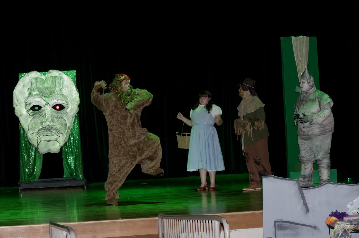 The lion (Alex Stansbery) runs form the Wizard of Oz The lion (Alex Stansbery) runs form the Wizard of Oz
