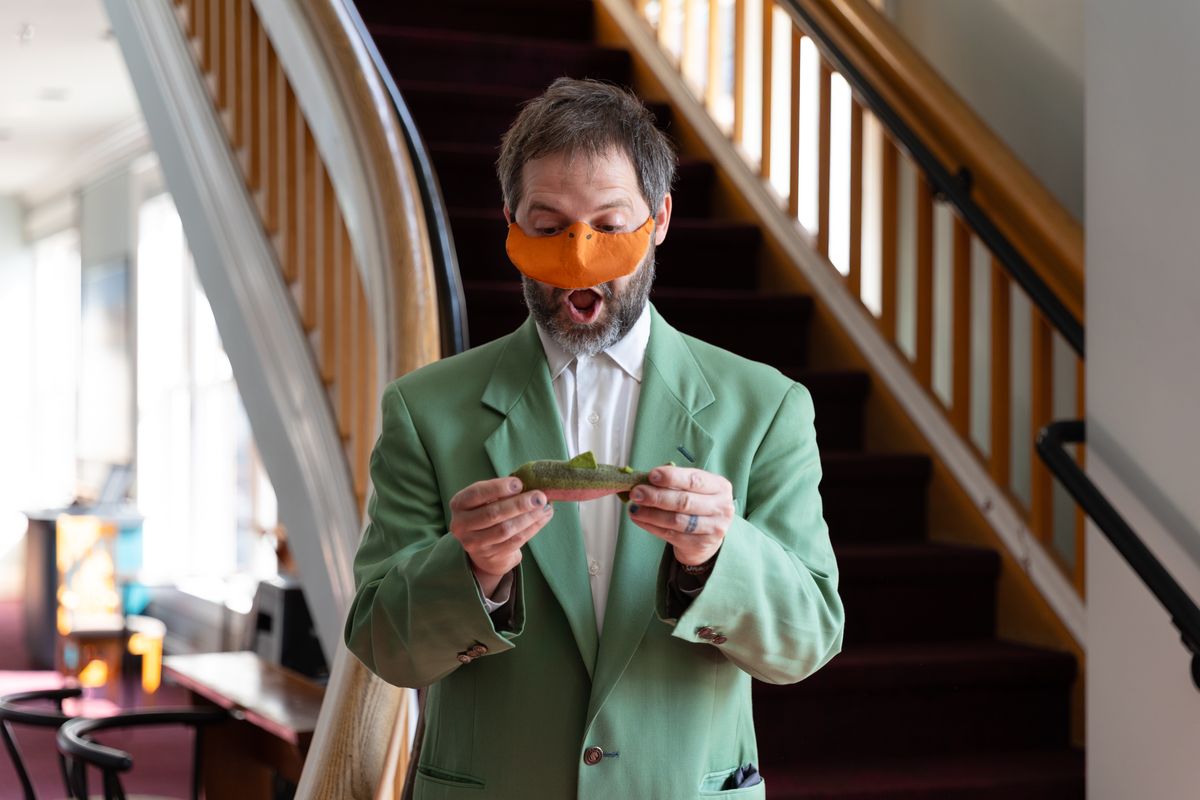 Nate Speckman plays Mr. Duck, the American delegate who always gets his fish in Heart of Duckness by A.J. Ditty. Photo by Hannah Daly Ellsworth. Nate Speckman plays Mr. Duck, the American delegate who always gets his fish in Heart of Duckness by A.J. Ditty. Photo by Hannah Daly Ellsworth.