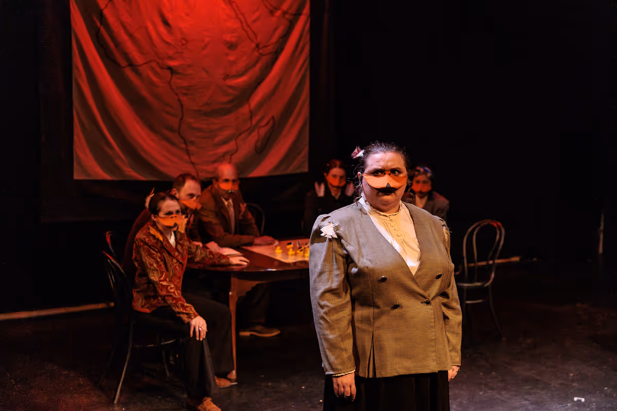 All eyes are on Marquês de Penaquill (Hollie Pryor) during a crucial vote that will determine the futures of Africa and Europe in Heart of Duckness by A.J. Ditty. Photo by Kat Moraros Photography. All eyes are on Marquês de Penaquill (Hollie Pryor) during a crucial vote that will determine the futures of Africa and Europe in Heart of Duckness by A.J. Ditty. Photo by Kat Moraros Photography.