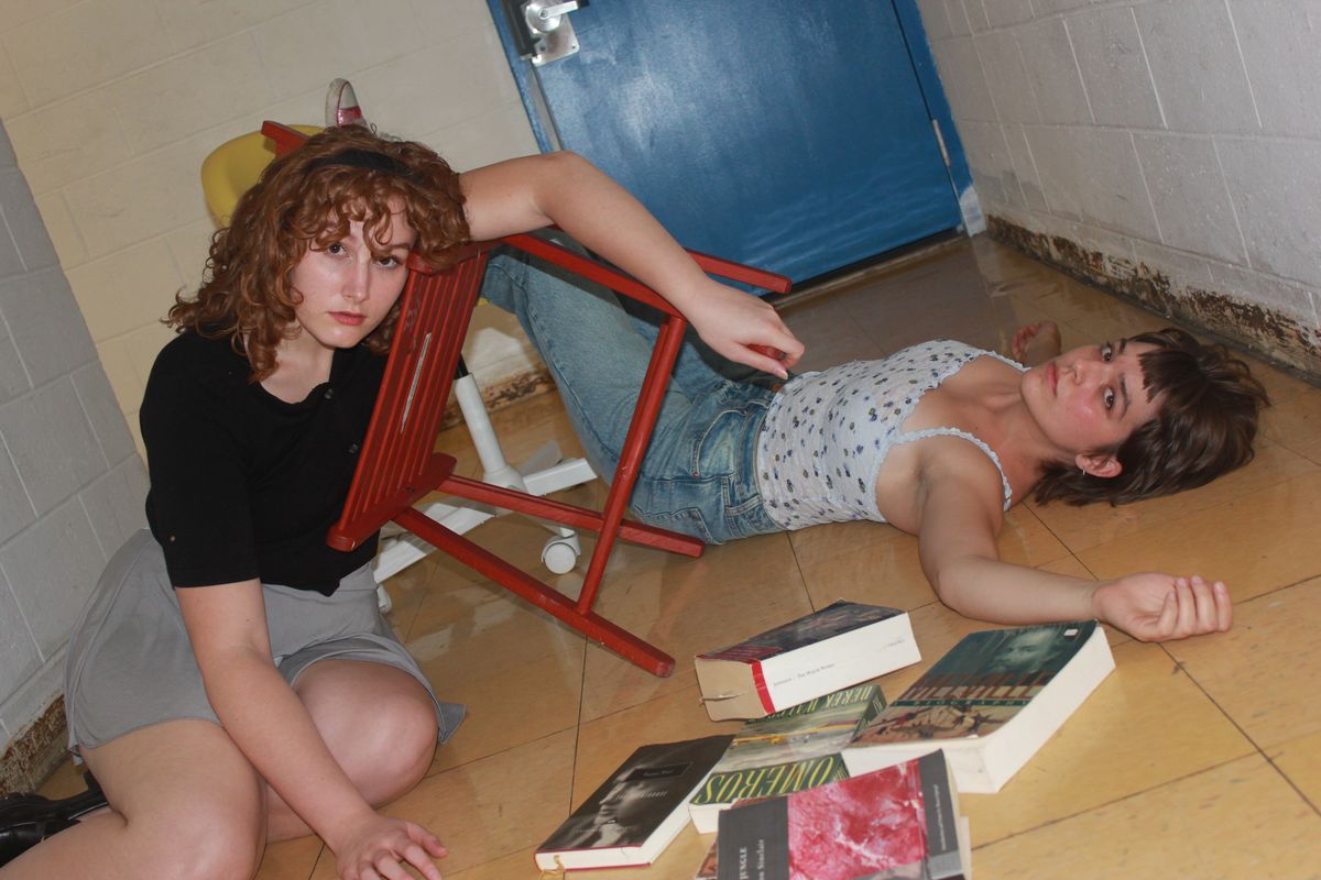(L–R) Brynn Smith (Laura) and Sylvie Schuetz (Lizzie) in 'The Melon’s Cry' at the Falls Center, part of the Philadelphia Fringe Festival. Photo by Jake Rhoda. (L–R) Brynn Smith (Laura) and Sylvie Schuetz (Lizzie) in 'The Melon’s Cry' at the Falls Center, part of the Philadelphia Fringe Festival. Photo by Jake Rhoda.