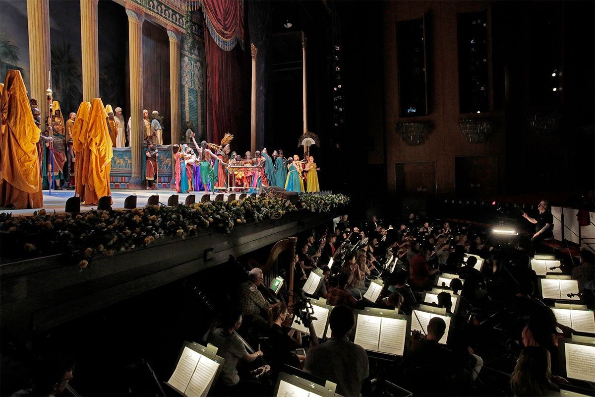 A scene from LA Opera's 2017 production of Nabucco. Shown: conductor James Conlon in the orchestra pit. (Photo: Ken Howard)