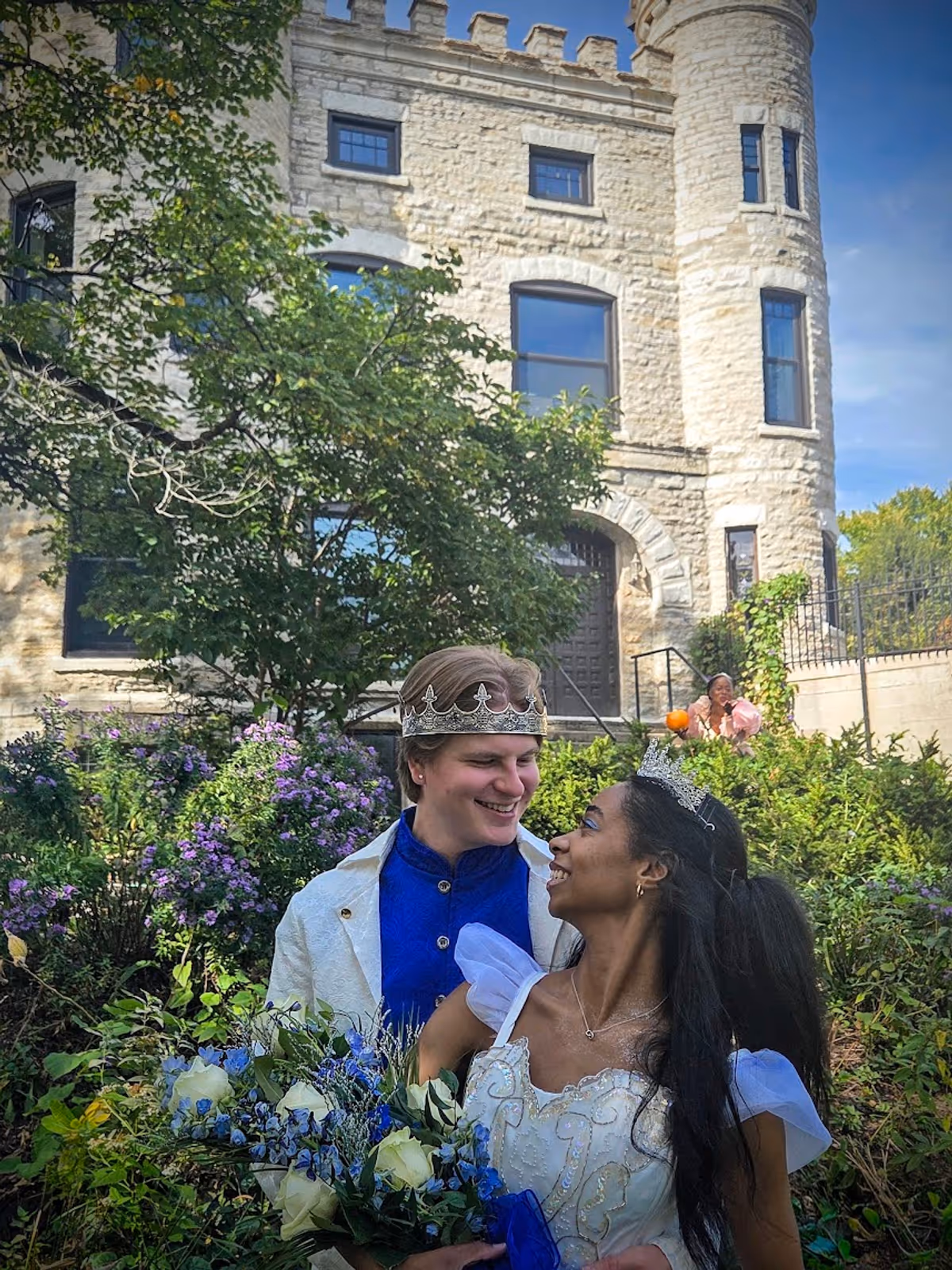 Prince Topher (Dylan Flaig), Ella (Sierra Basilio), and her Fairy Godmother in the distance in front of the Givins Castle in Beverly Prince Topher (Dylan Flaig), Ella (Sierra Basilio), and her Fairy Godmother in the distance in front of the Givins Castle in Beverly