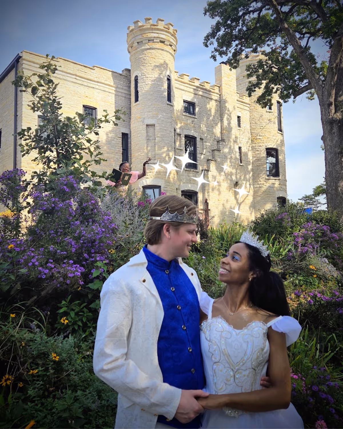 Prince Topher (Dylan Flaig), Ella (Sierra Basilio), and her Fairy Godmother in the distance in front of the Givins Castle in Beverly Prince Topher (Dylan Flaig), Ella (Sierra Basilio), and her Fairy Godmother in the distance in front of the Givins Castle in Beverly