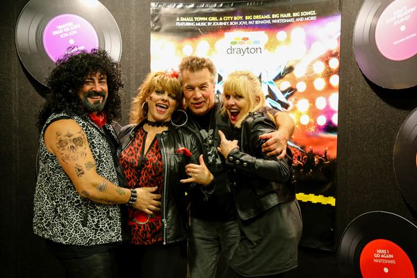 Audience members visiting from 9 hours away dress up for the Rock of Ages opening!  3