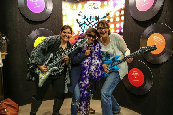 Audience members enjoy the photobooth on opening night for Rock of Ages!  4