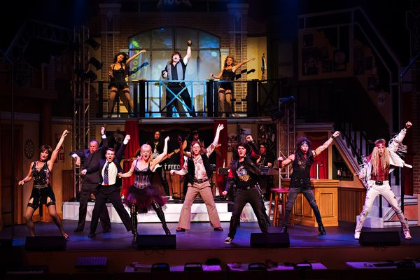 Company of Rock of Ages, Drayton Entertainment. 
Set Design: Samantha Burson. Costume Design: Adrienne Pink. Lighting Design: Jeff JohnstonCollins. Projections Design: Dan Payne. Photographer: Hilary Gauld Camilleri.  6