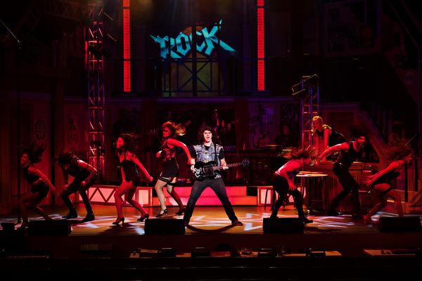 Kale Penny and Company in Rock of Ages, Drayton Entertainment. Set Design: Samantha Burson. Costume Design: Adrienne Pink. Lighting Design: Jeff JohnstonCollins. Projections Design: Dan Payne. Photographer: Hilary Gauld Camilleri.  7