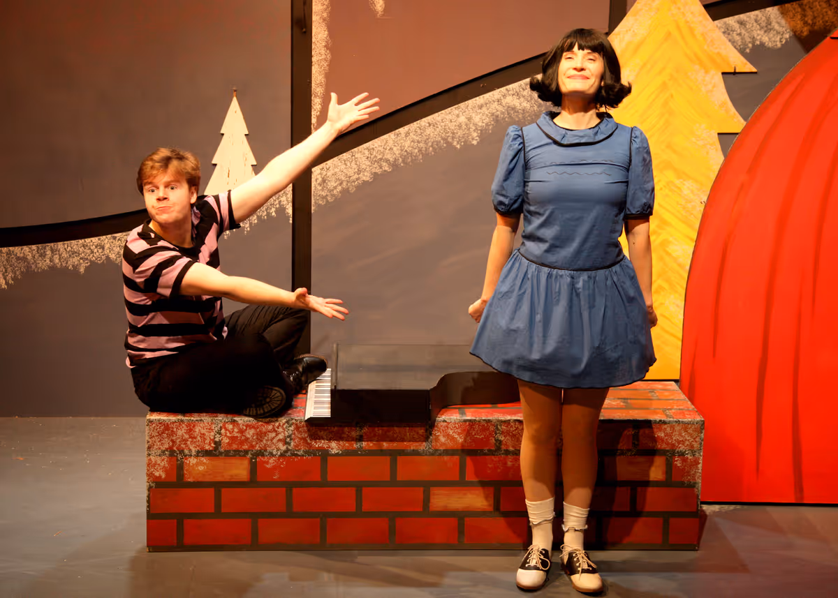 Christopher Diem and Laura M. Hathaway in the encore presentation of “A Charlie Brown Christmas.” This live version of Charles Schulz’s classic television special adapted by Eric Schaeffer and directed by James Michael McHale will run thru December 19, 2021 on the Fyda-Mar Stage at the Bette Aitken theater arts Center.
