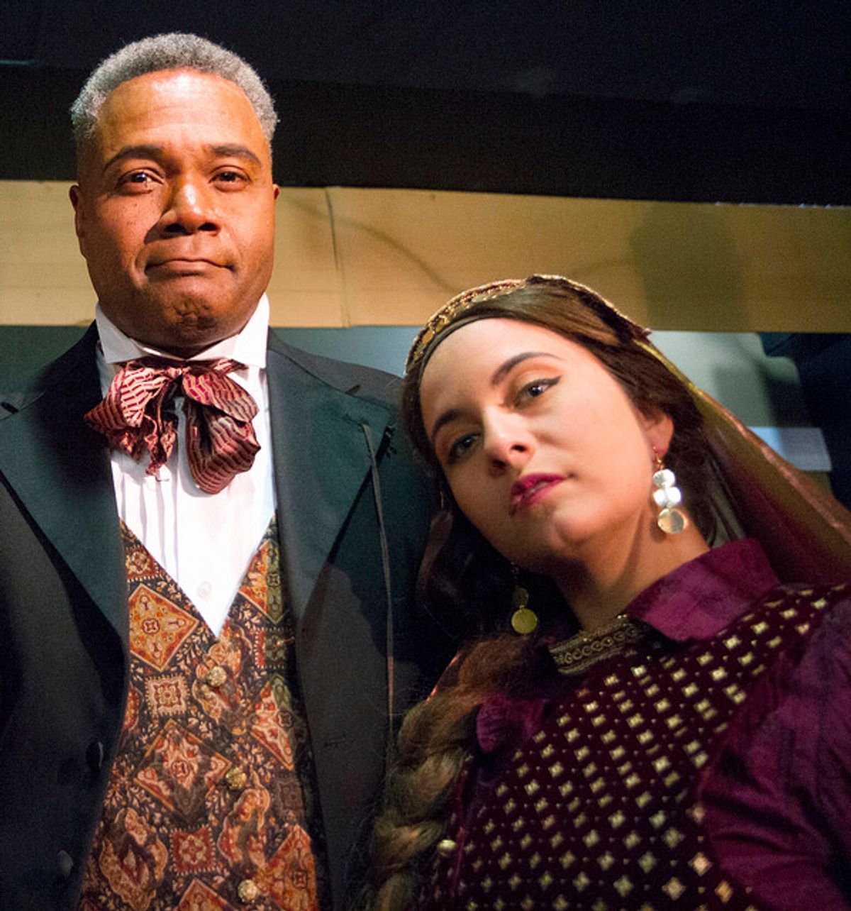Presenting A Prime Suspect!: Darryl Maximilian Robinson as The Chairman Mr. William Cartwright and Mayor Thomas Sapsea tells us about Anna Galluci as Helena Landless and Miss Janet Conover in the 2018 Saint Sebastian Players of Chicago Revival of Rupert Holmes' 'The Mystery of Edwin Drood'. Photo by Eryn Walanka. Presenting A Prime Suspect!: Darryl Maximilian Robinson as The Chairman Mr. William Cartwright and Mayor Thomas Sapsea tells us about Anna Galluci as Helena Landless and Miss Janet Conover in the 2018 Saint Sebastian Players of Chicago Revival of Rupert Holmes' 'The Mystery of Edwin Drood'. Photo by Eryn Walanka.