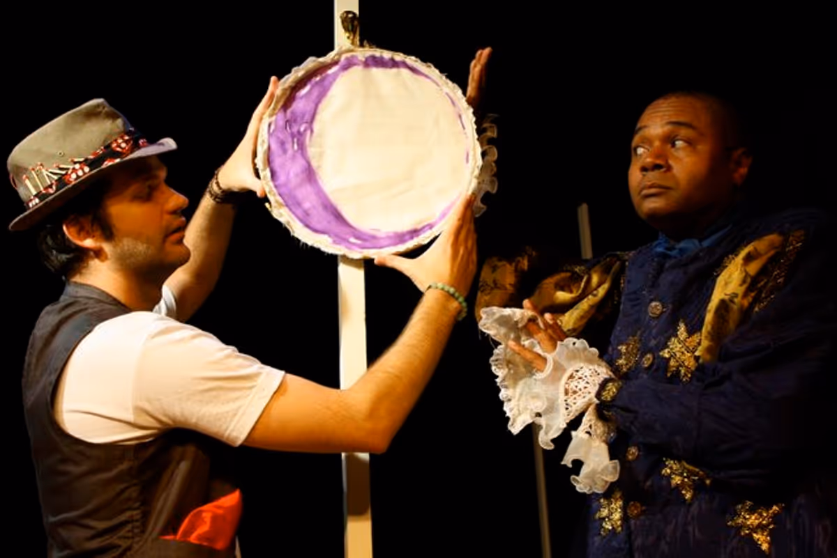 YOUR MOON, SIR!: Christopher Karbo as El Gallo and Darryl Maximilian Robinson as Henry Albertson contemplate The Moon in a scene from the 2010 Tribe Productions 50th anniversary revival production of Tom Jones' and Harvey Schmidt's classic, romantic musical "The Fantasticks" presented as part the first-ever Hollywood Fringe Festival at The Complex Theatre of Los Angeles. YOUR MOON, SIR!: Christopher Karbo as El Gallo and Darryl Maximilian Robinson as Henry Albertson contemplate The Moon in a scene from the 2010 Tribe Productions 50th anniversary revival production of Tom Jones' and Harvey Schmidt's classic, romantic musical "The Fantasticks" presented as part the first-ever Hollywood Fringe Festival at The Complex Theatre of Los Angeles.
