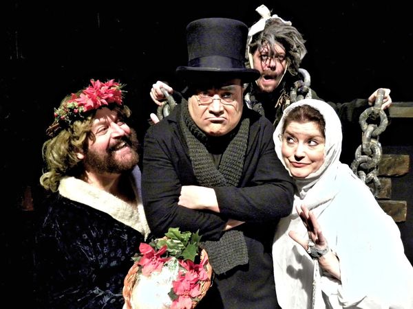 David C. Mitchell stars as Ebenezer Scrooge who is haunted by Christmas Present (Roger VanDette,) Jacob Marley (David G. Poole) and Christmas Past (Joyce Stilson.) 1