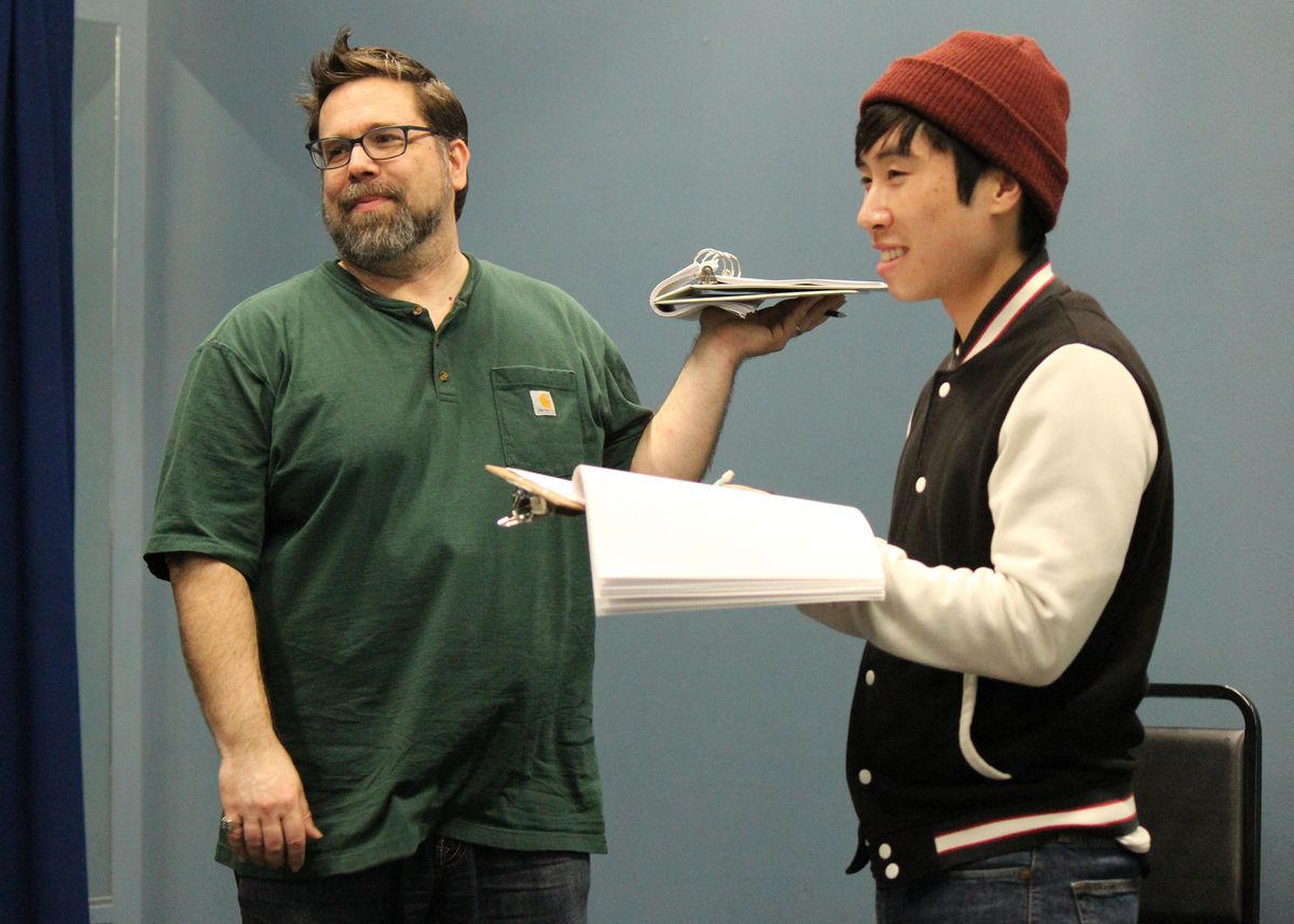 Casey Long and Dustin Vuong Nguyen  in rehearsals for the rolling world premiere of "Colonialism is Terrible, But Phở is Delicious" at Chance Theater. Photo by Shinshin Yuder Tsai. 
