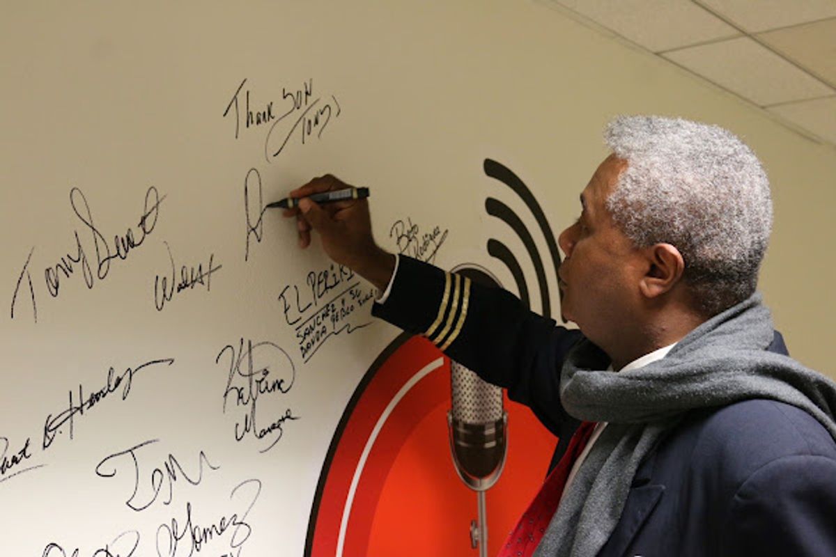 SIGNING THE UBNGO STUDIO WALL!: After his fourth appearance on Ron Brewington's 'The Actor's Choice', veteran and award-winning stage actor and play director Darryl Maximilian Robinson was invited to sign the studio's logo wall. Photo by J.L. Watt. SIGNING THE UBNGO STUDIO WALL!: After his fourth appearance on Ron Brewington's 'The Actor's Choice', veteran and award-winning stage actor and play director Darryl Maximilian Robinson was invited to sign the studio's logo wall. Photo by J.L. Watt.