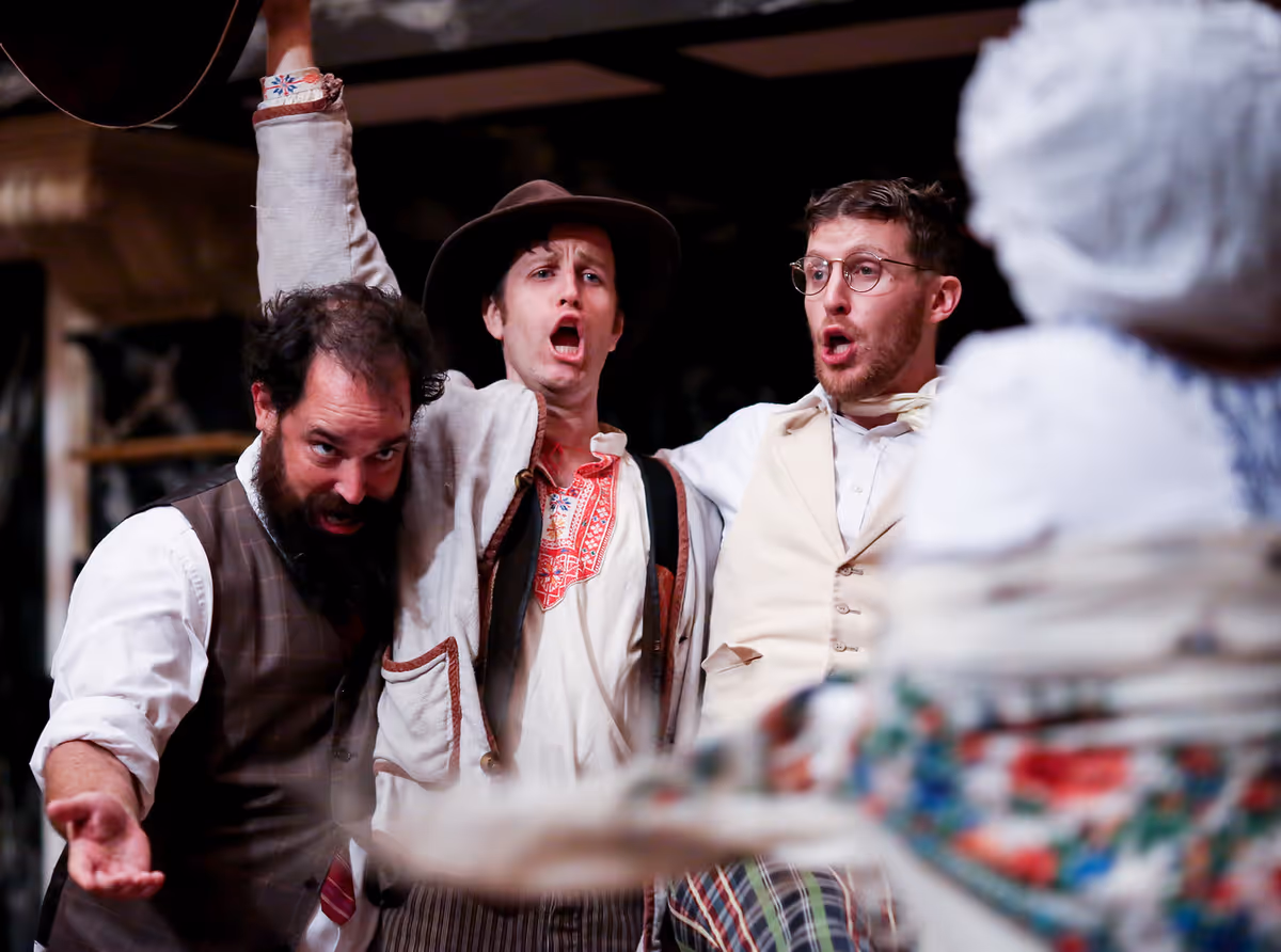Sir Toby Belch (David Anthony Lawson), Feste (Chris Johnston), and Sir Andrew Aguecheek (Patrick Earl) sing and celebrate. Sir Toby Belch (David Anthony Lawson), Feste (Chris Johnston), and Sir Andrew Aguecheek (Patrick Earl) sing and celebrate.