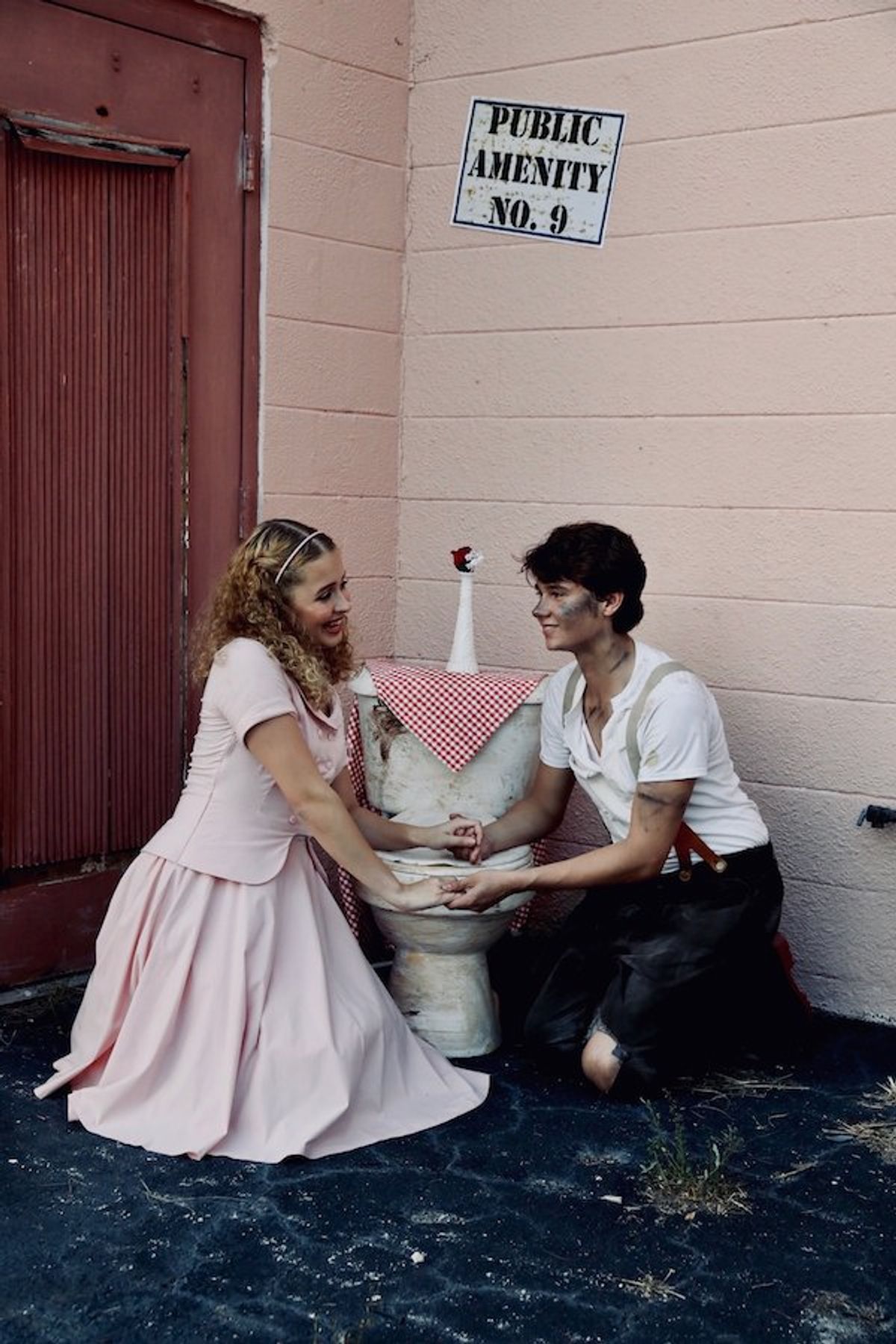 Belle Babcock as Hope Cladwell and Jonah McKinley as Bobby Strong in Urinetown at Venice Theatre